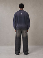 Model wearing the SM Sig. Shadow Fade Bomber Jacket in Deep Purple, rear view.