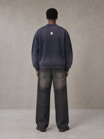 Model wearing the SM Sig. Shadow Fade Bomber Jacket in Deep Purple, rear view.
