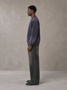 Model wearing the SM Sig. Shadow Fade Bomber Jacket in Deep Purple, side profile.