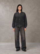 Model wearing the SM Sig. Shadow Fade Bomber Jacket in Midnight Black, front view.