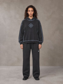 Model wearing the SM Sig. Straight Leg Sweatpants in Deep Charcoal, front view.