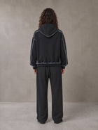 Model wearing the SM Sig. Straight Leg Sweatpants in Deep Charcoal, rear view.