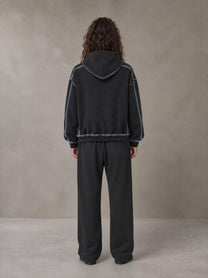 Model wearing the SM Sig. Straight Leg Sweatpants in Deep Charcoal, rear view.