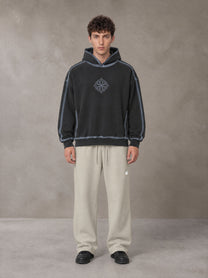 Model wearing the SM Sig. Straight Leg Sweatpants in Fine Sand, front view.