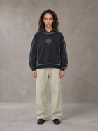 Model wearing the SM Sig. Straight Leg Sweatpants in Fine Sand, front view.
