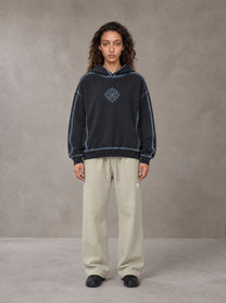 Model wearing the SM Sig. Straight Leg Sweatpants in Fine Sand, front view.