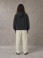 Model wearing the SM Sig. Straight Leg Sweatpants in Fine Sand, rear view.