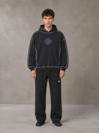 Model wearing the SM Sig. Straight Leg Sweatpants in Midnight Black, front view.