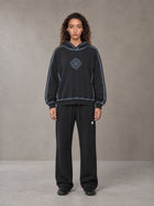 Model wearing the SM Sig. Straight Leg Sweatpants in Midnight Black, front view.