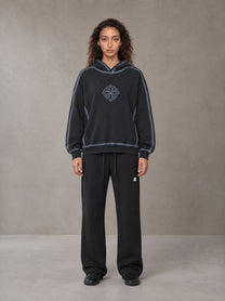 Model wearing the SM Sig. Straight Leg Sweatpants in Midnight Black, front view.