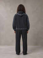 Model wearing the SM Sig. Straight Leg Sweatpants in Midnight Black, rear view.