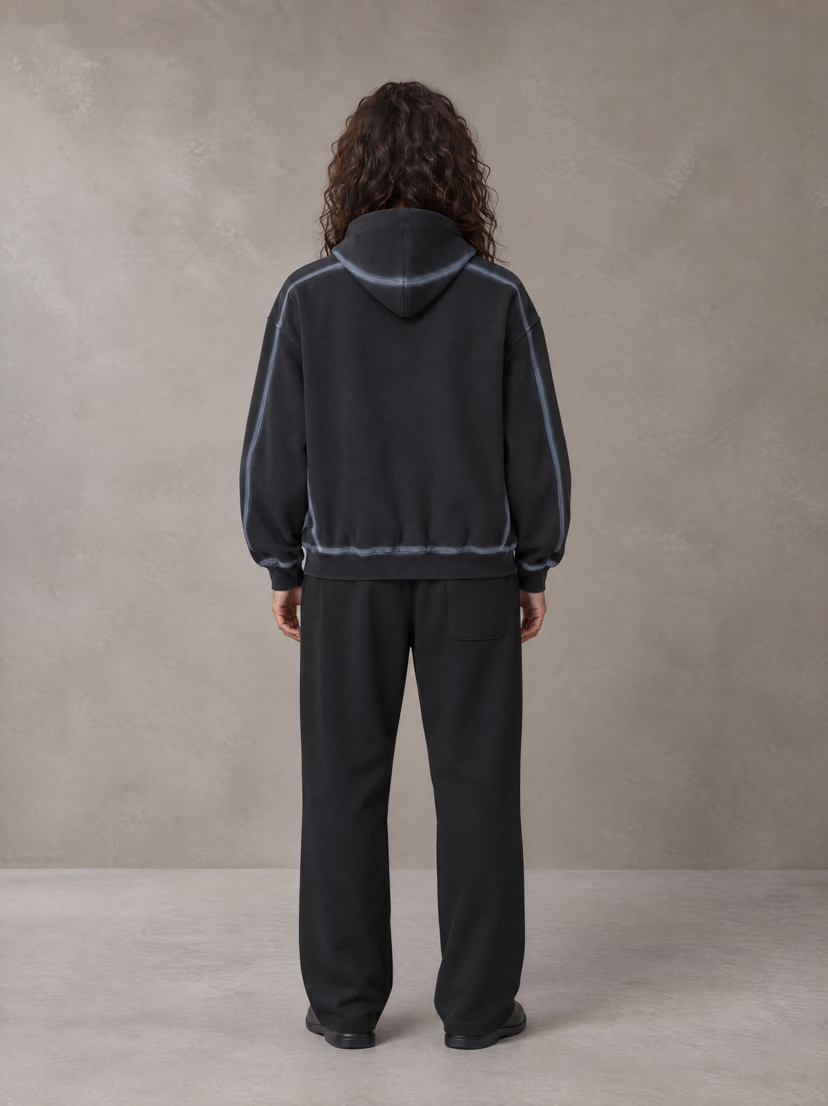 Model wearing the SM Sig. Straight Leg Sweatpants in Midnight Black, rear view.