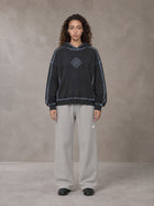 Model wearing the SM Sig. Straight Leg Sweatpants in Pure Grey, front view.