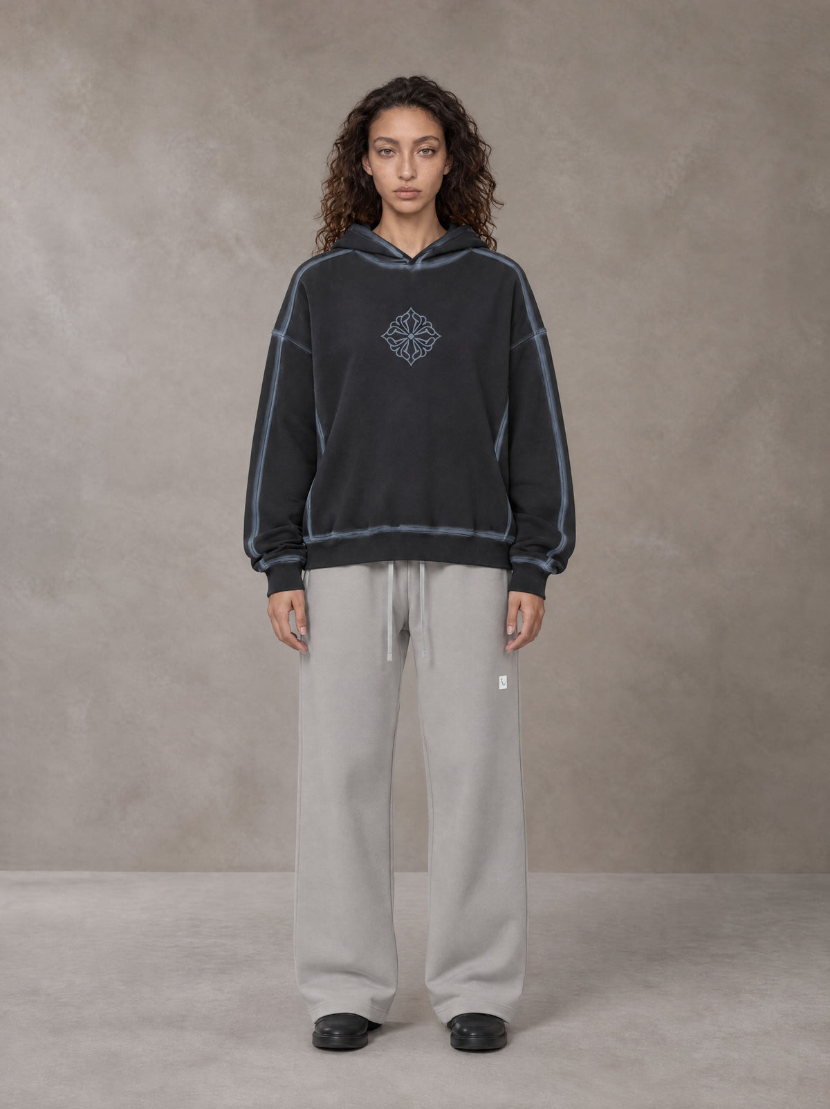 Model wearing the SM Sig. Straight Leg Sweatpants in Pure Grey, front view.