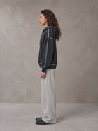 Model wearing the SM Sig. Straight Leg Sweatpants in Pure Grey, side profile.