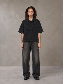 Model wearing the SM Shadowline Denim Zip T-shirt in Midnight Black, front view.