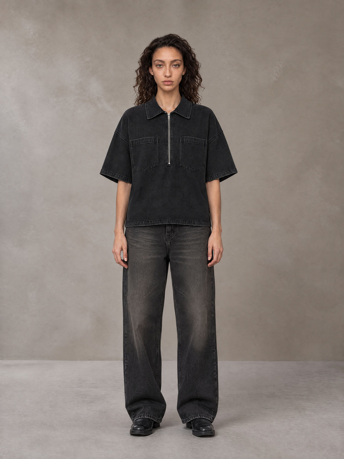 Model wearing the SM Shadowline Denim Zip T-shirt in Midnight Black, front view.
