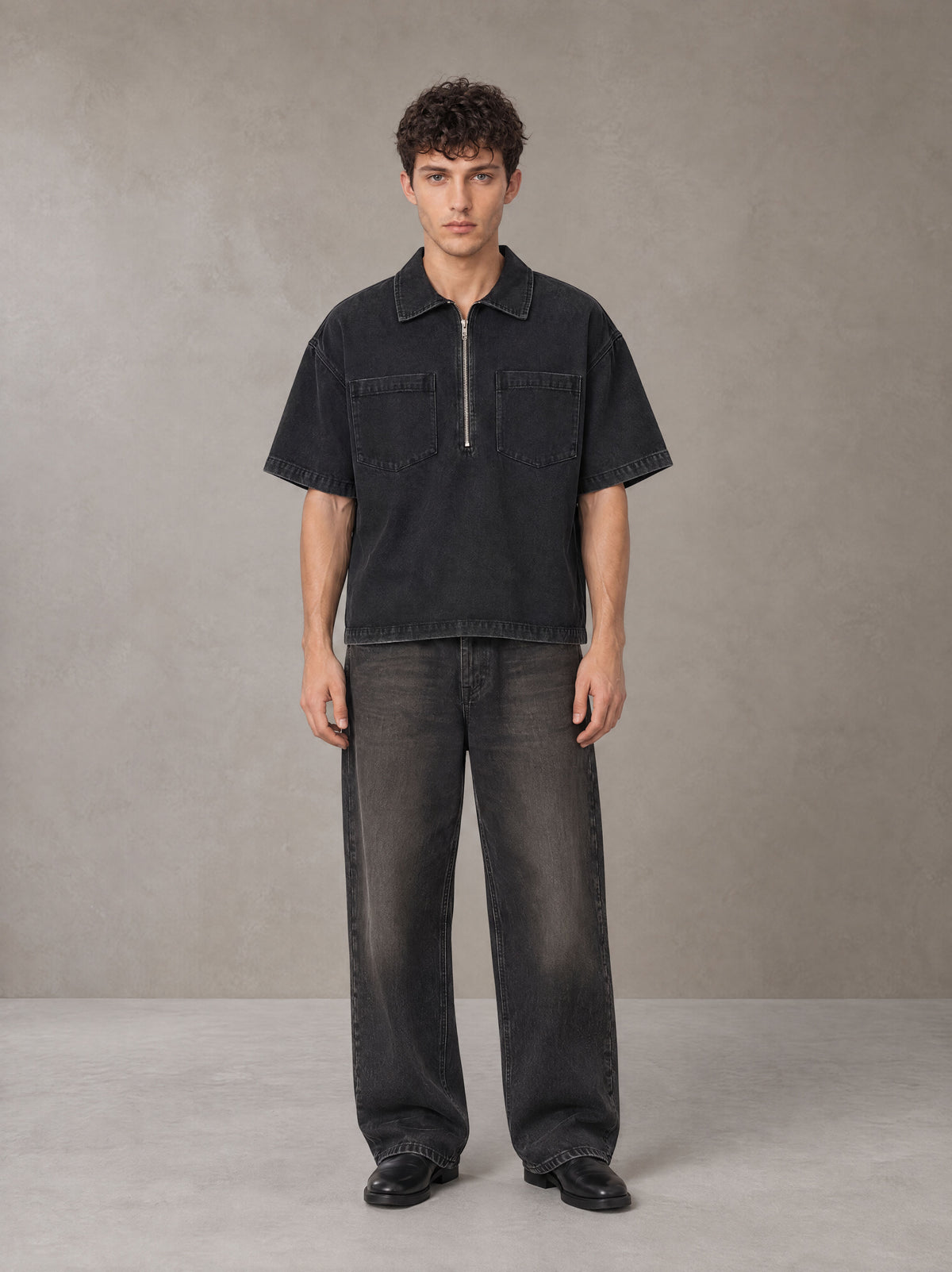 Model wearing the SM Shadowline Denim Zip T-shirt in Midnight Black, front view.