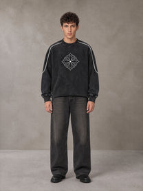Model wearing the SM Fleur Eclipse Sweatshirt in Midnight Black, front view.