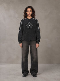 Model wearing the SM Fleur Eclipse Sweatshirt in Midnight Black, front view.