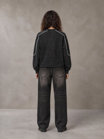 Model wearing the SM Fleur Eclipse Sweatshirt in Midnight Black, rear view.