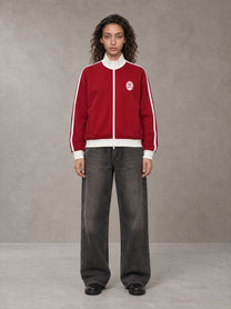 Model wearing the SM Insignia Contrast Trim Jacket in Deep Carmine, front view.