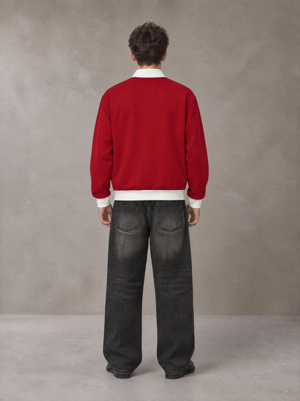 Model wearing the SM Insignia Contrast Trim Jacket in Deep Carmine, rear view.
