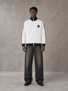 Model wearing the SM Insignia Contrast Trim Jacket in Lucent White, front view.