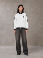 Model wearing the SM Insignia Contrast Trim Jacket in Lucent White, front view.