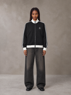 Model wearing the SM Insignia Contrast Trim Jacket in Midnight Black, front view.