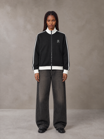 Model wearing the SM Insignia Contrast Trim Jacket in Midnight Black, front view.