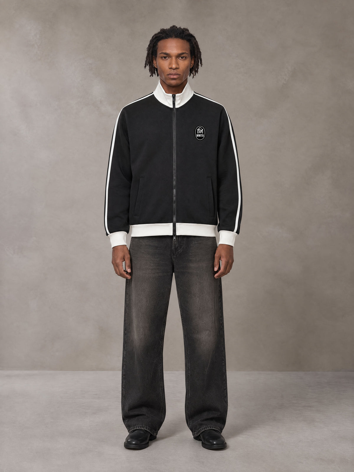 Model wearing the SM Insignia Contrast Trim Jacket in Midnight Black, front view.