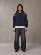 Model wearing the SM Insignia Hoodie in Oxford Navy, front view.