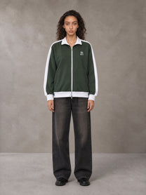 Model wearing the SM Insignia Jacket in Olive Shade, front view.