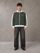 Model wearing the SM Insignia Jacket in Olive Shade, front view.