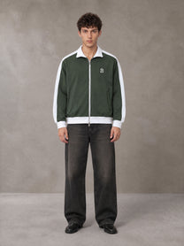 Model wearing the SM Insignia Jacket in Olive Shade, front view.