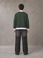 Model wearing the SM Insignia Jacket in Olive Shade, rear view.