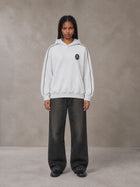 Model wearing the SM Insignia Parallel Hoodie in Floral Grey, front view.
