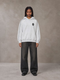 Model wearing the SM Insignia Parallel Hoodie in Floral Grey, front view.