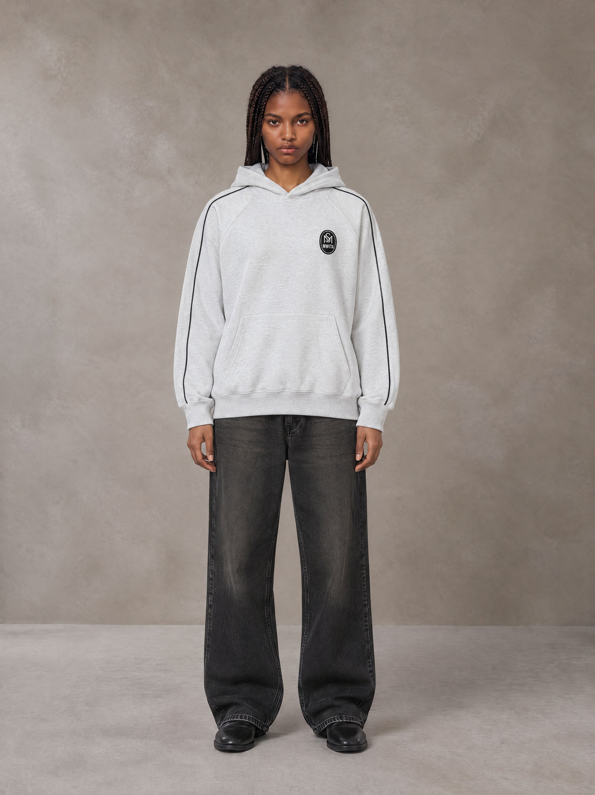 Model wearing the SM Insignia Parallel Hoodie in Floral Grey, front view.
