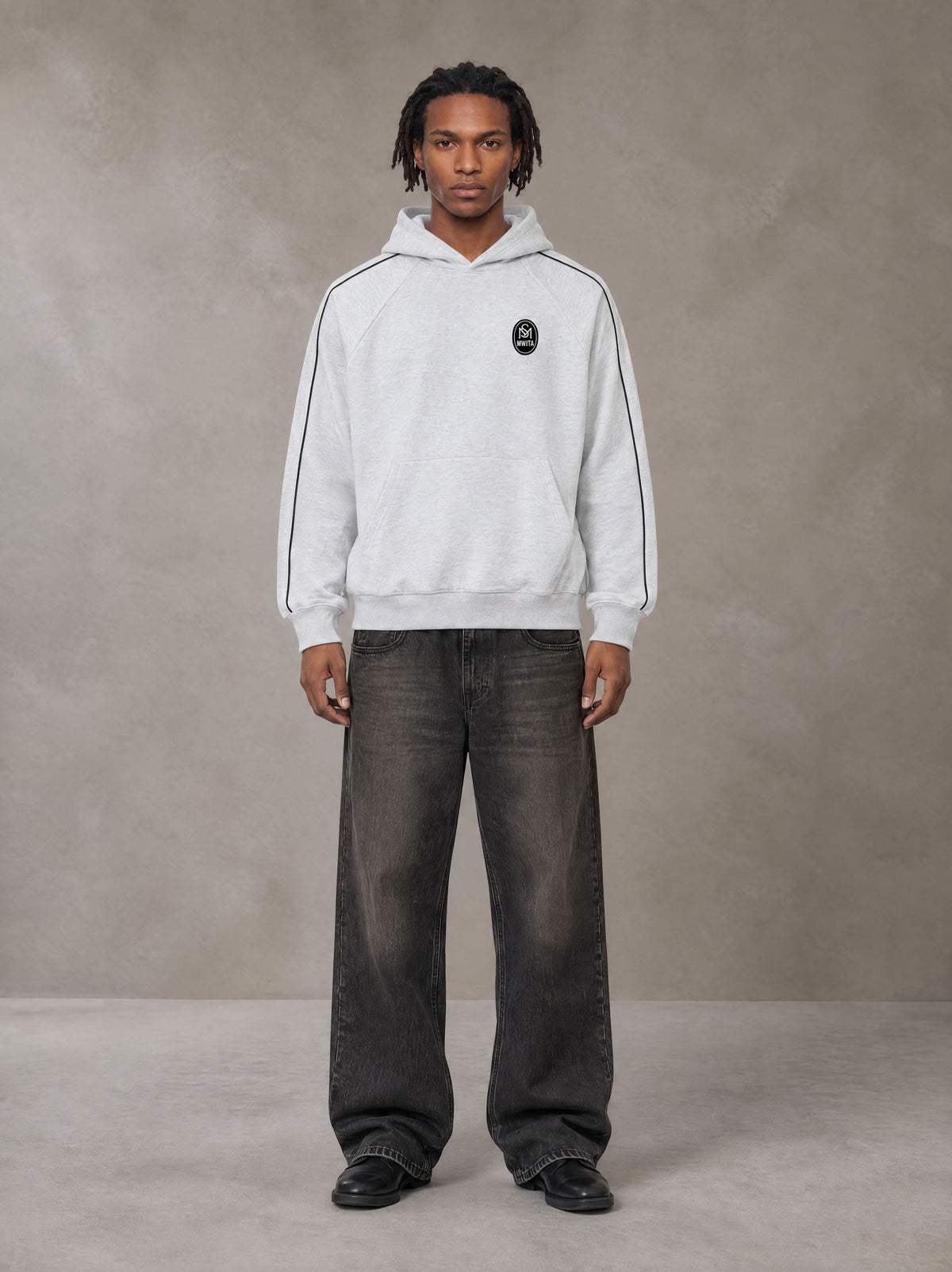 Model wearing the SM Insignia Parallel Hoodie in Floral Grey, front view.