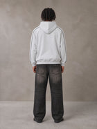 Model wearing the SM Insignia Parallel Hoodie in Floral Grey, rear view.