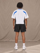 Model wearing the SM Motion Vector Jersey in Lucent White, rear view.