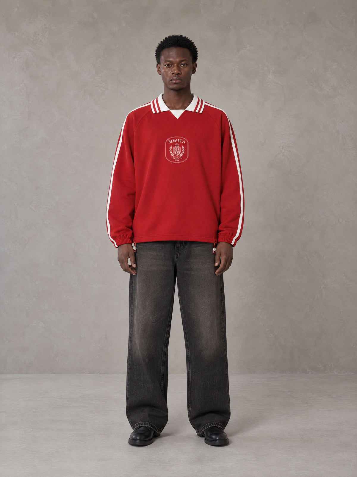 Model wearing the SM Royal Emblem Panel Sweatshirt in Crimson, front view.