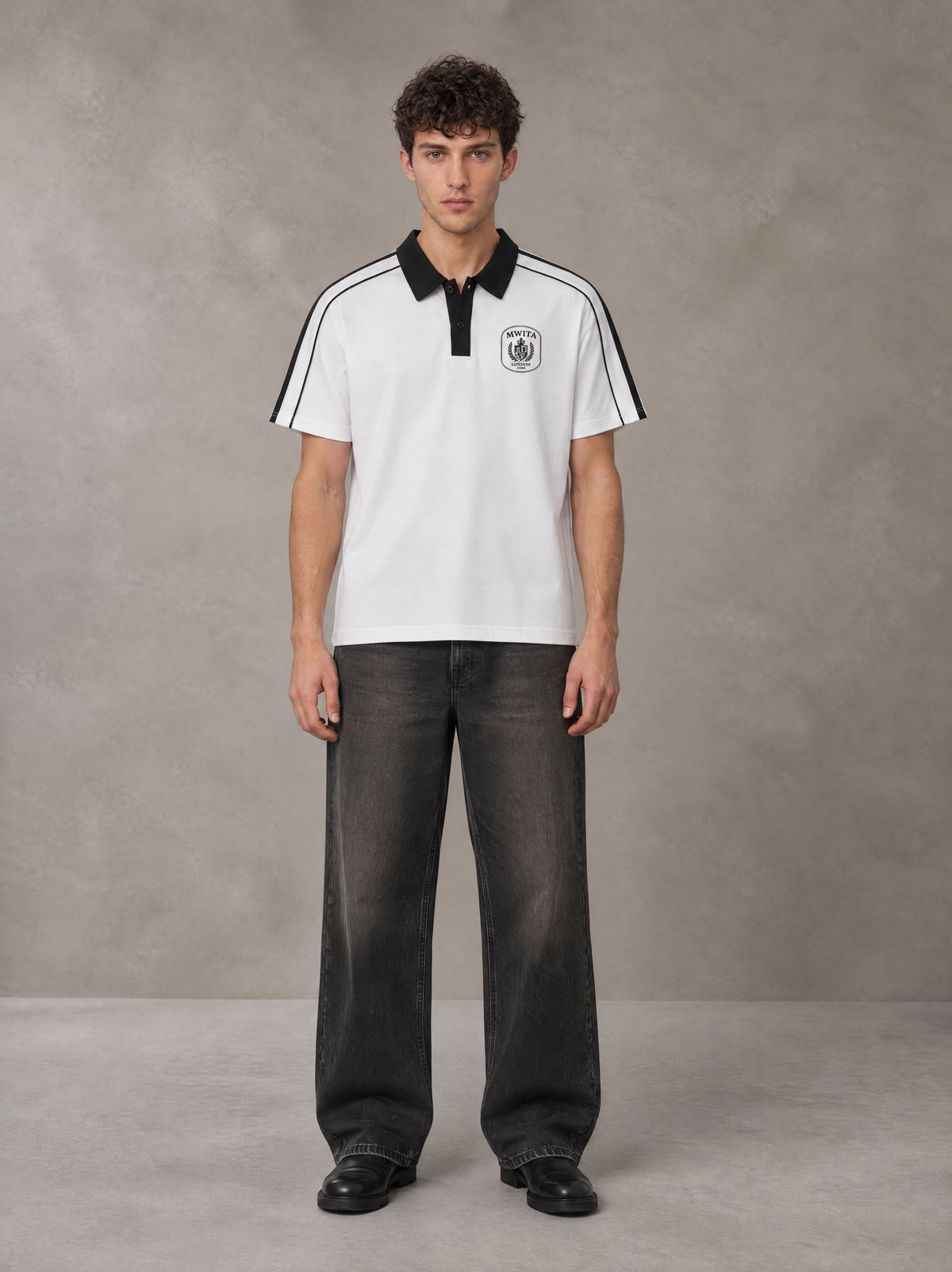 Model wearing the SM Royal Emblem Polo T-shirt in Lucent White, front view.