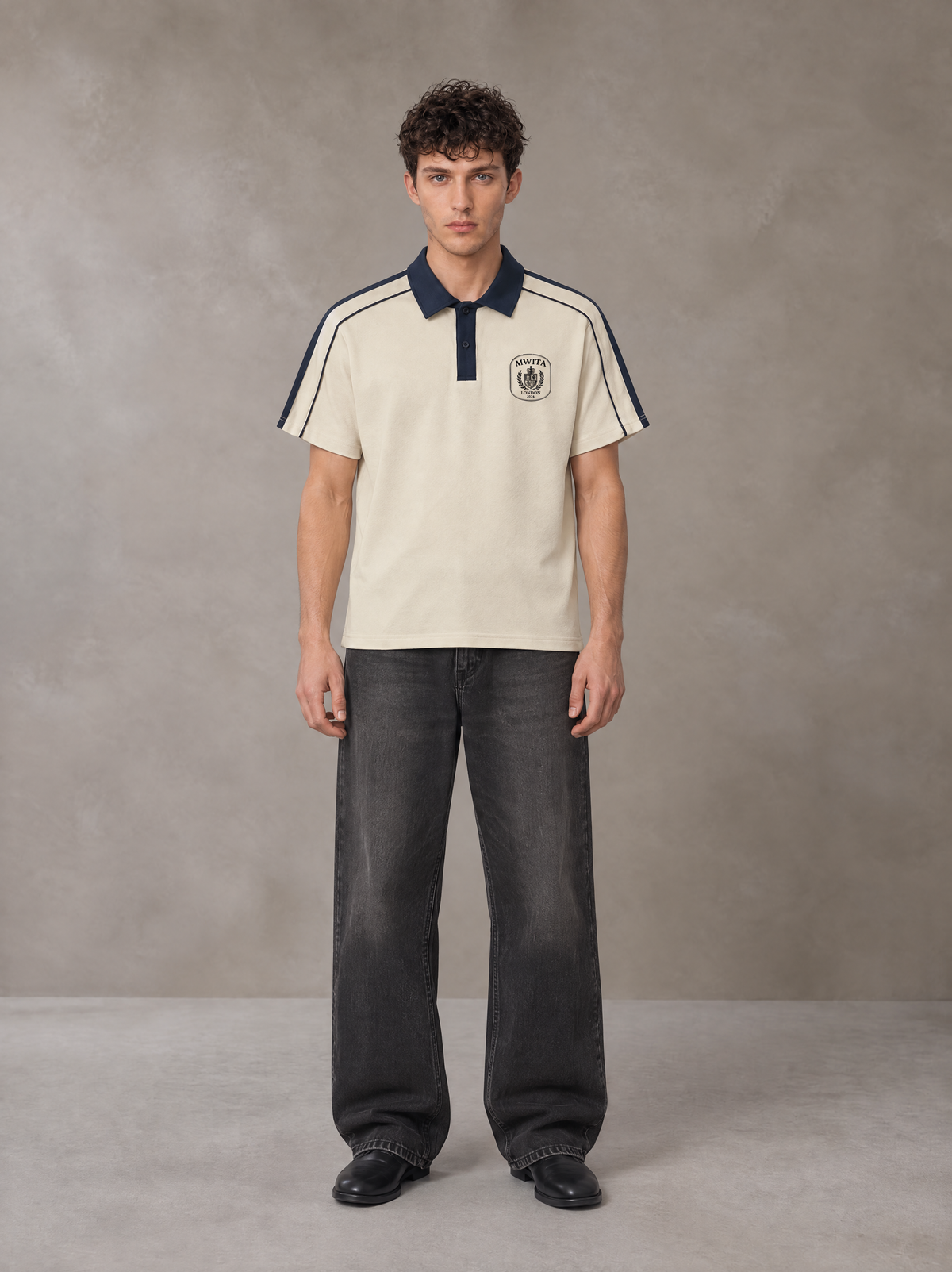 Model wearing the SM Royal Emblem Polo T-shirt in Soft Beige, front view.
