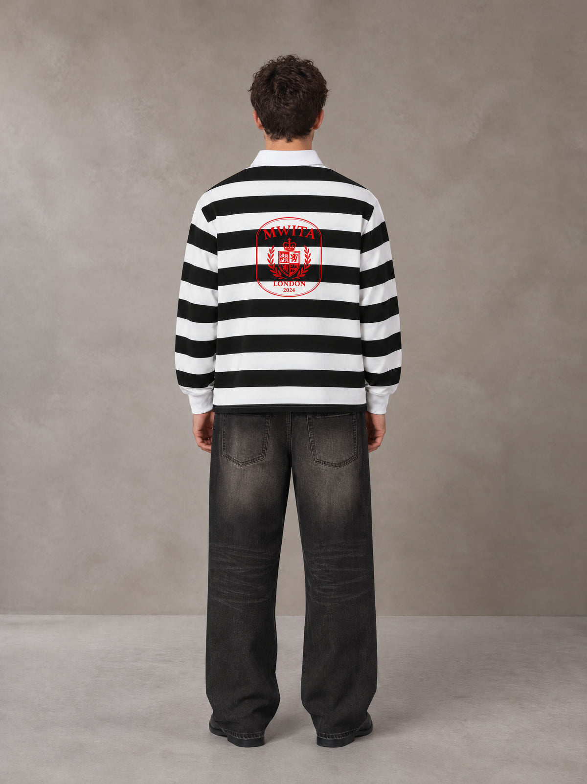 Model wearing the SM Royal Emblem Rugby Polo T-shirt in Lucent White, rear view.
