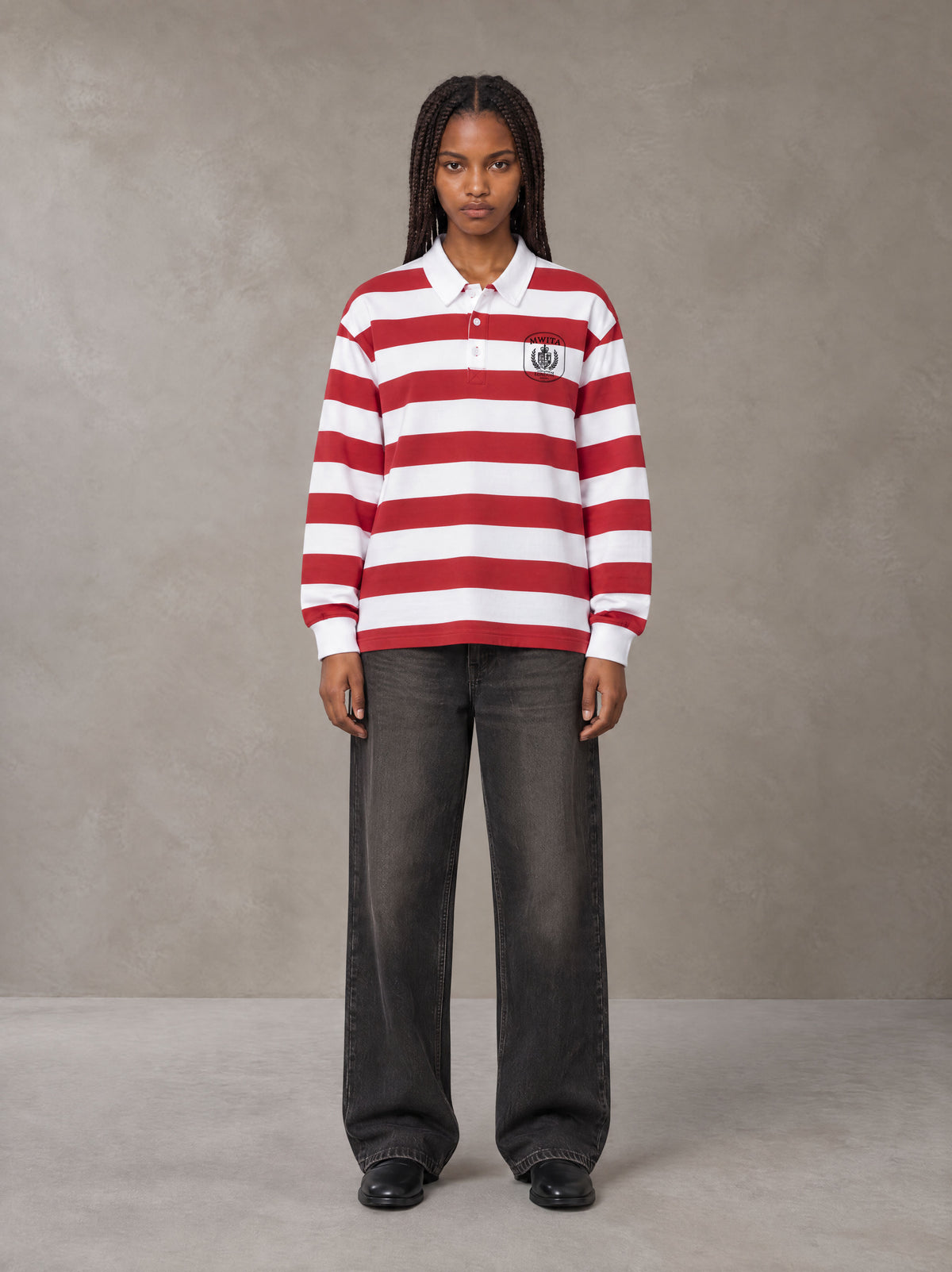 Model wearing the SM Royal Emblem Rugby Polo T-shirt in Deep Carmine, front view.