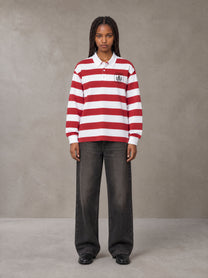 Model wearing the SM Royal Emblem Rugby Polo T-shirt in Deep Carmine, front view.