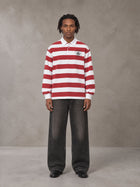 Model wearing the SM Royal Emblem Rugby Polo T-shirt in Deep Carmine, front view.